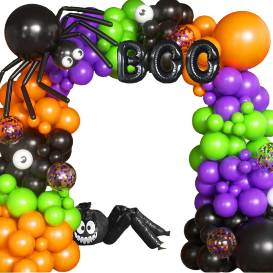 Halloween-themed balloon arch with colorful balloons and decorations in front of a house.