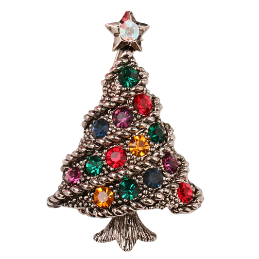 Christmas tree-shaped brooch with colorful gemstones on a white background