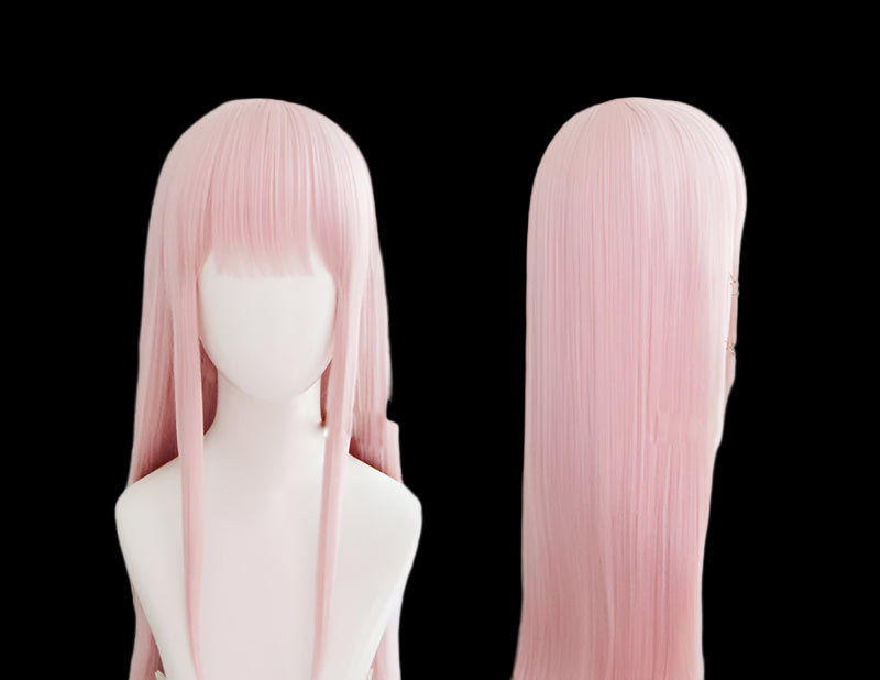 Pink wig on a mannequin head with a soft, blurred background