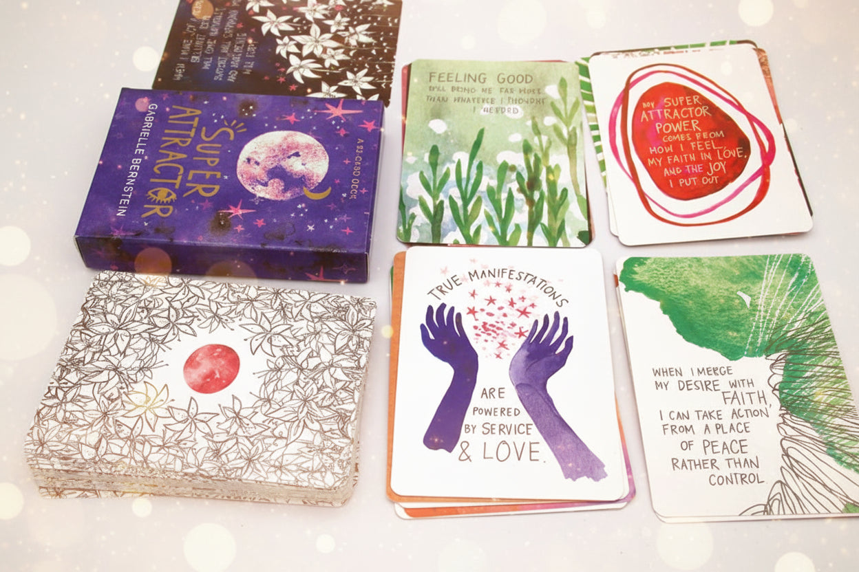 Collection of colorful cards with various designs and text on a white surface