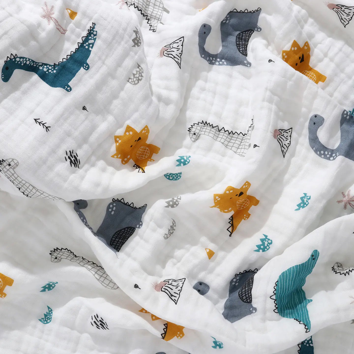 White fabric with colorful animal prints including dinosaurs, foxes, and stars.