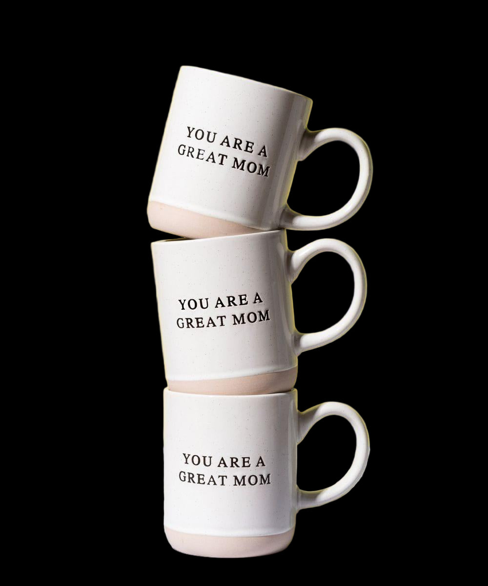 Stack of three white mugs with 'YOU ARE A GREAT MOM' text on a yellow background