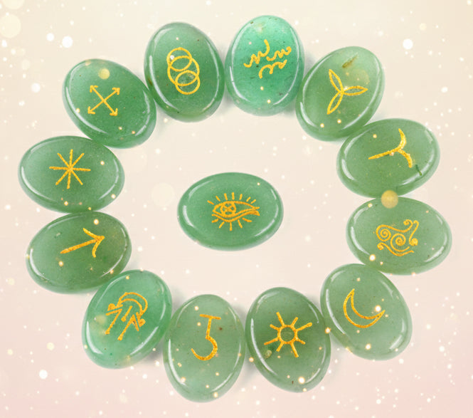 Green stones with yellow symbols arranged in a circular pattern on a white background
