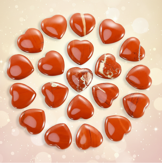 Heart-shaped red stones on a white background