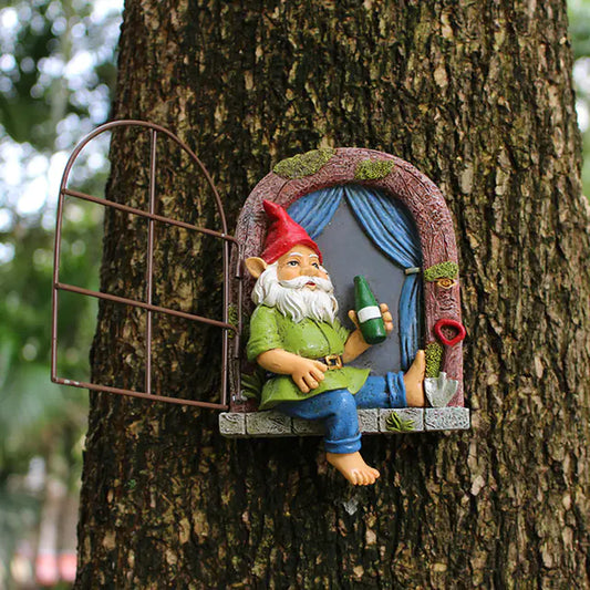Gnome figurine with a beer bottle sitting in a tree house.