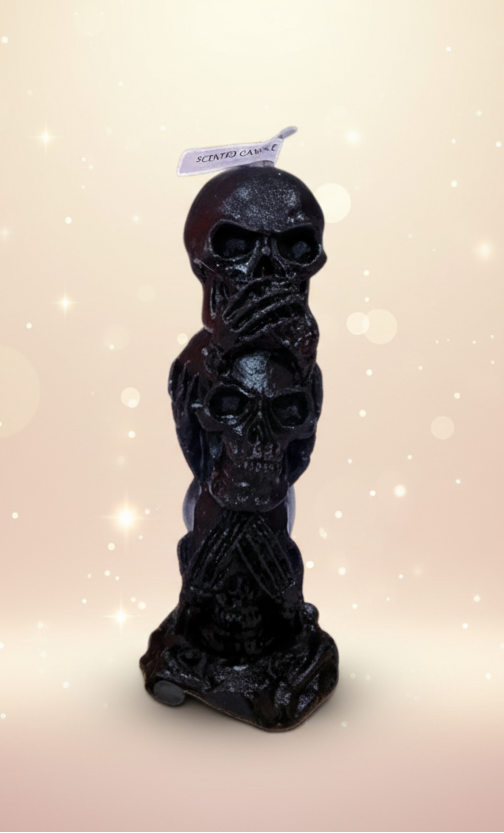 Decorative candle with skull design on a white background