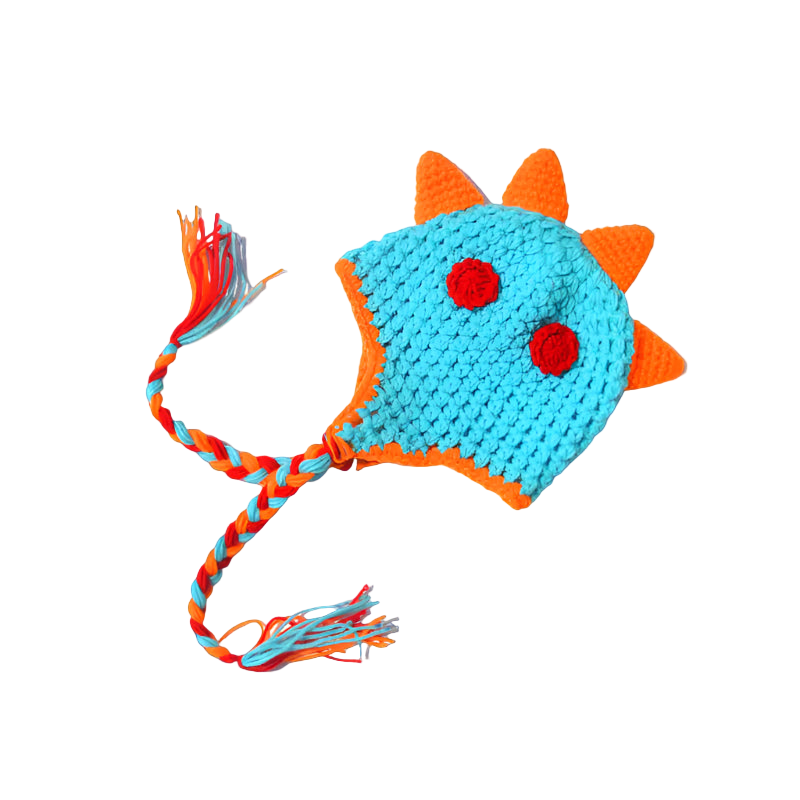 Crocheted dinosaur hat with orange spikes and a braided tail on a white background