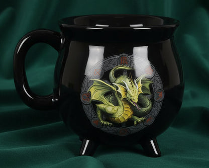 Black mug with a dragon design on a white background