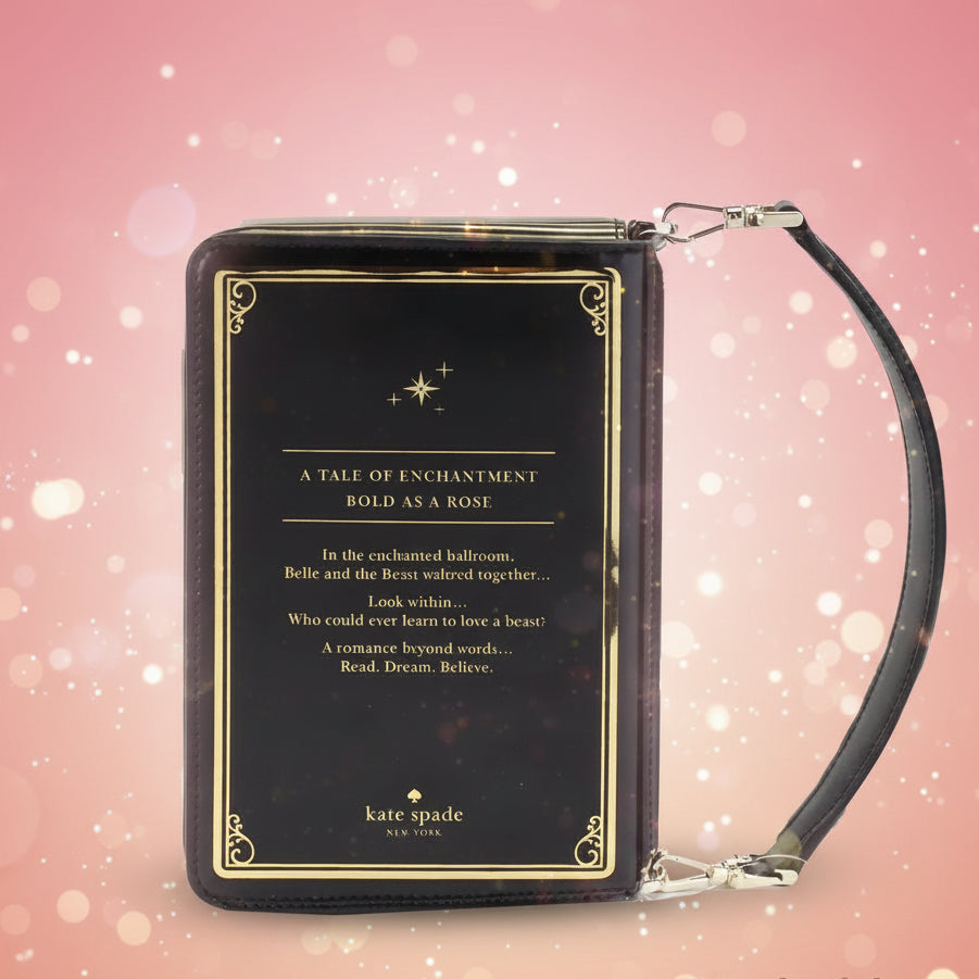 Black wristlet with gold text and 'kate spade' branding on a white background