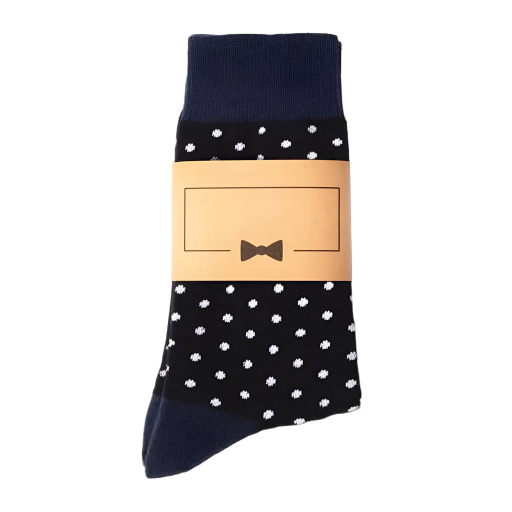 Black socks with white polka dots and a beige label on a white background