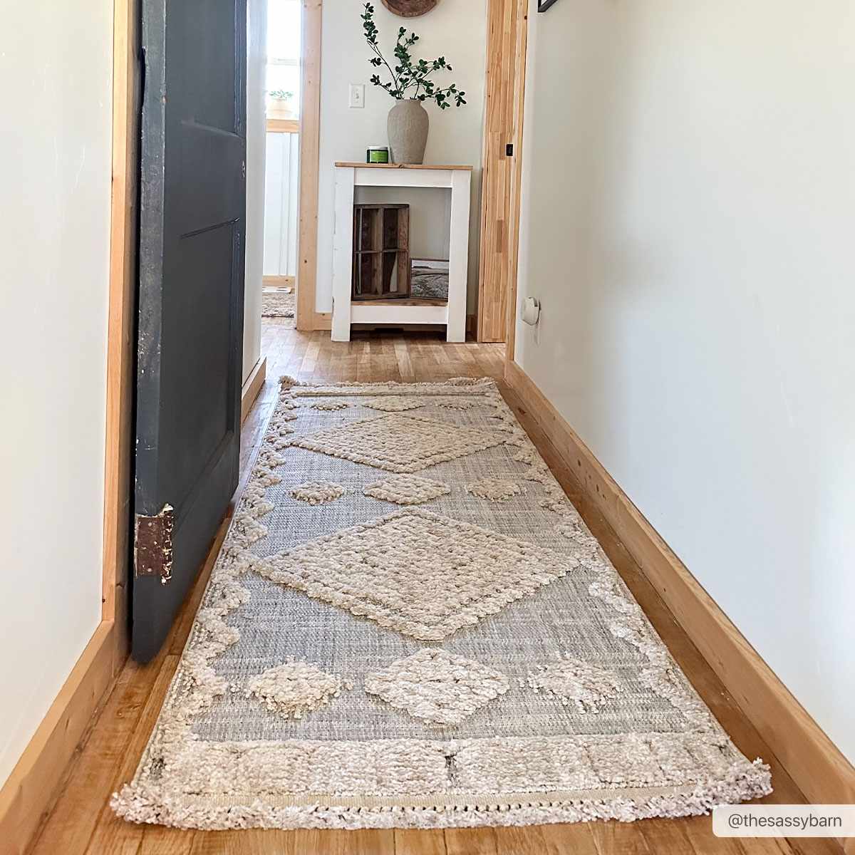 Patterned rug on a wooden floor in a home setting