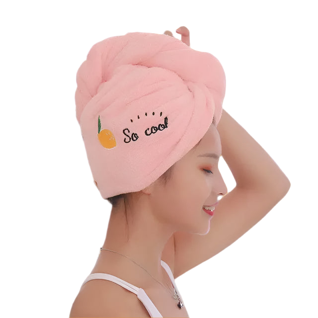 Woman wearing a pink towel with 'So cool' text and an orange emoji against a white background