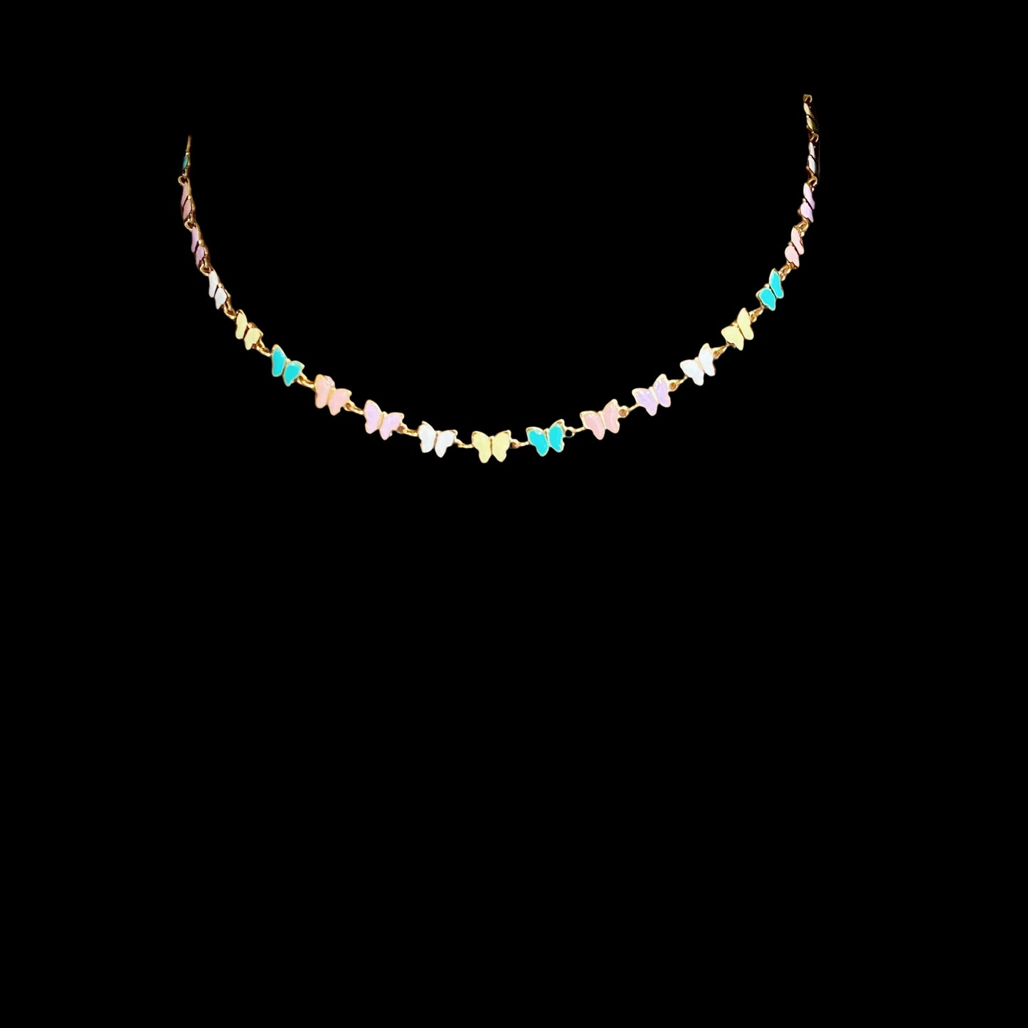 Necklace with colorful butterfly pendants worn by a person