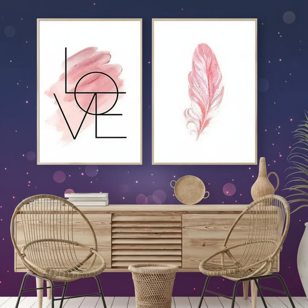 Two framed pink feather artworks on a wall above a wooden console table with wicker chairs.