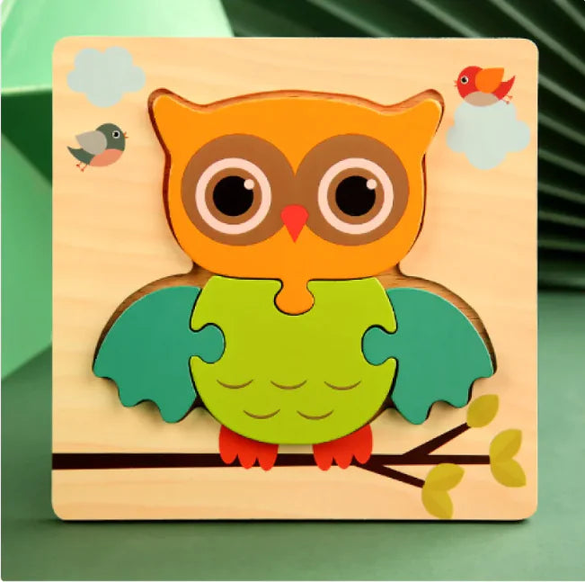 Wooden owl puzzle toy on a green background