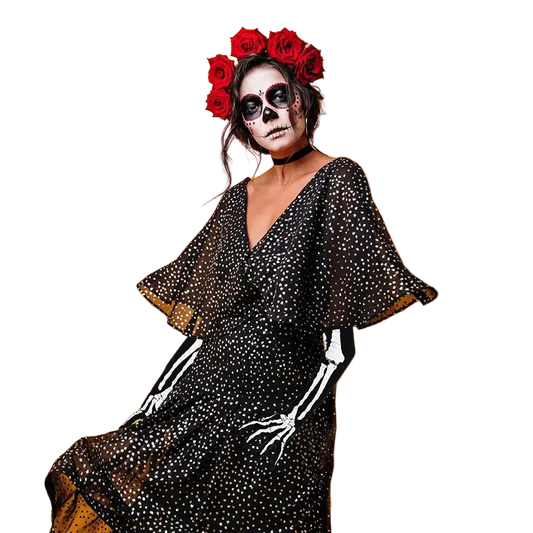Person in a black dress with skeleton arm and white face makeup on an orange background