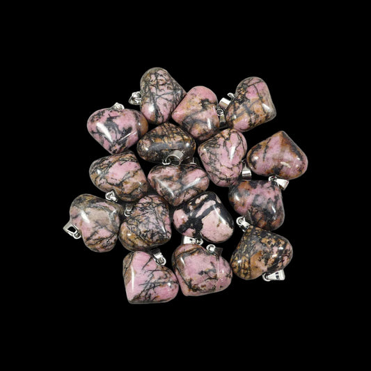 Collection of pink and brown marbled stones on a light gray background