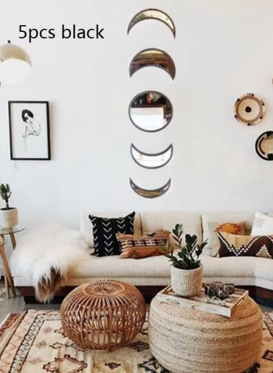 Living room with decorative wall mirrors and a white sofa.
