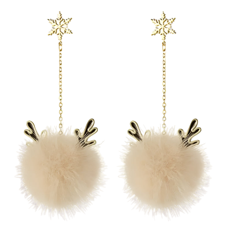 Pair of earrings with fluffy beige balls and gold antlers on a white background