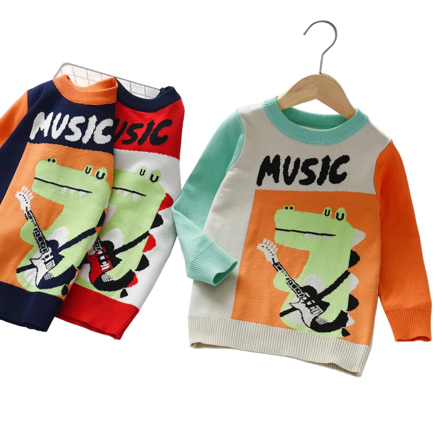 Two children's sweaters with a frog playing guitar design and 'Music' text on a white background.