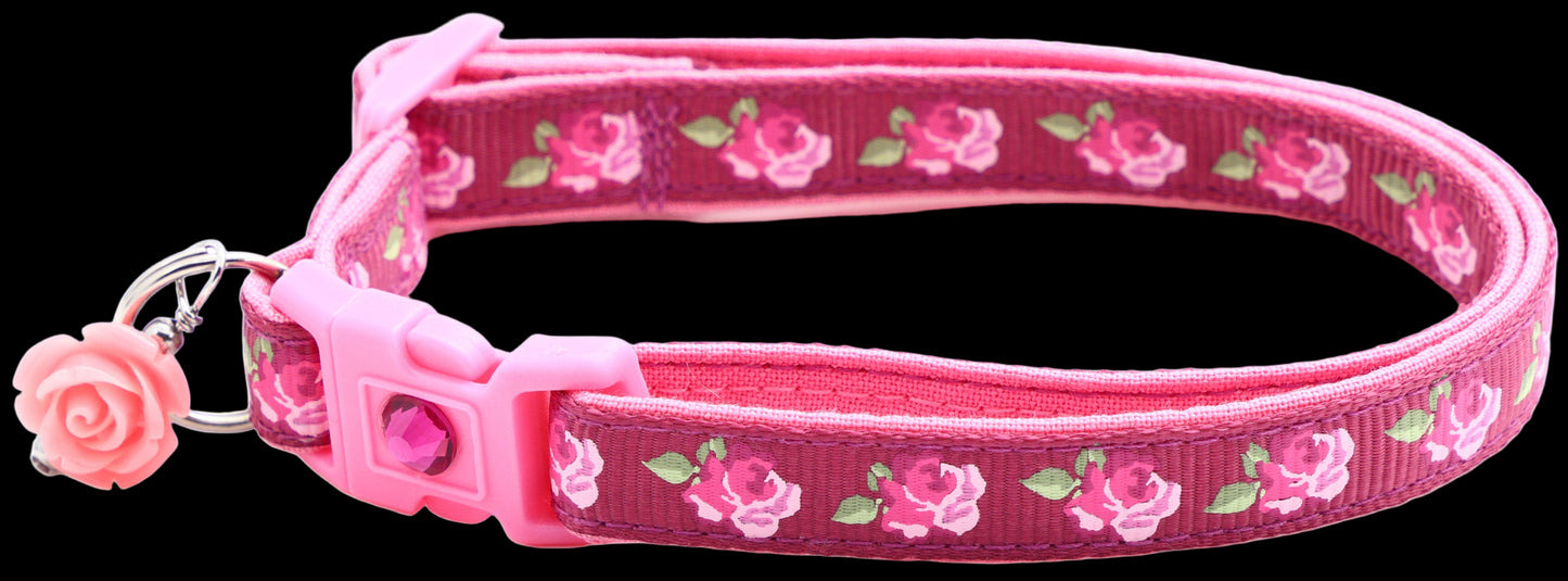 Pink dog collar with floral pattern on a white background