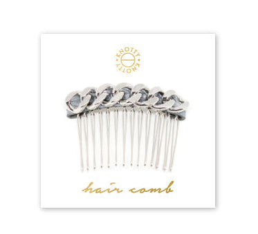 Silver hair comb on a white card with 'hair comb' text