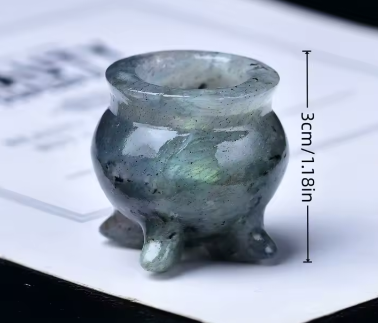 Small ceramic tripod pot with dimensions indicated on a white background