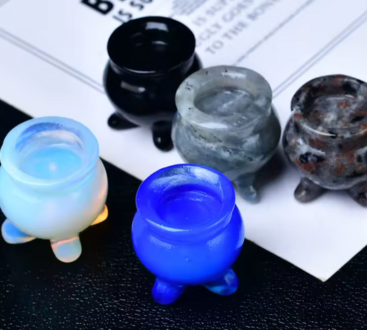 Set of colorful glass ashtrays on a newspaper background