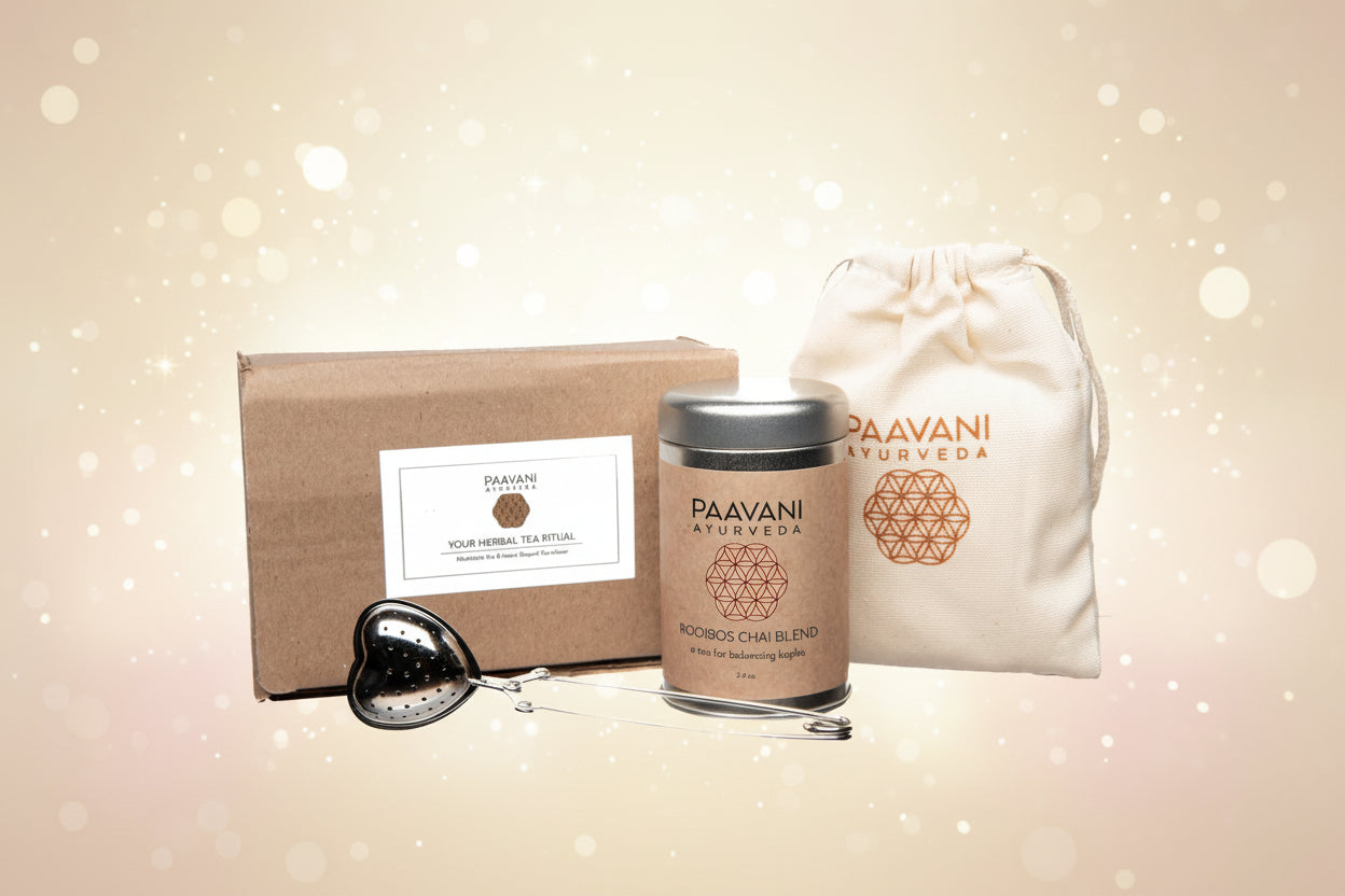 Paavani Ayurveda tea set with a box, tea canister, and drawstring bag on a white background