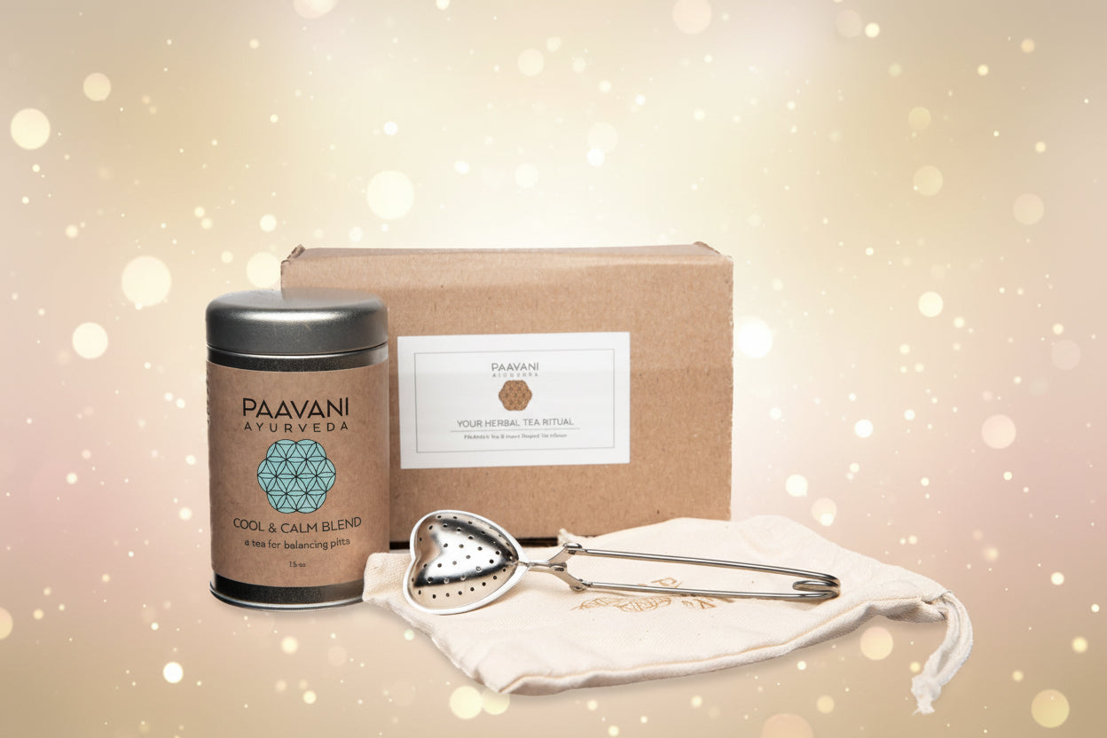 Paavani Ayurveda tea blend with a box, strainer, and pouch on a white background
