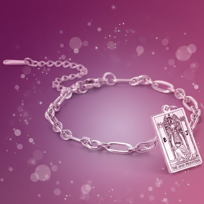 Silver bracelet with a tarot card charm on a white background