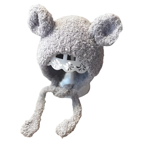Gray fuzzy mouse-shaped hat with a white lace design on a white background