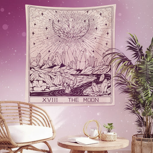 Decorative tapestry with celestial design hanging on a wall above a chair and table.