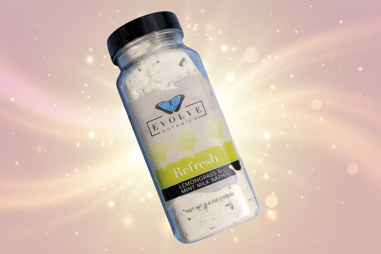 Bottle of Evolve Botanica Lemongrass & Mint Milk Bath on a white background