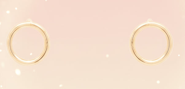 Gold hoop earrings on a white background