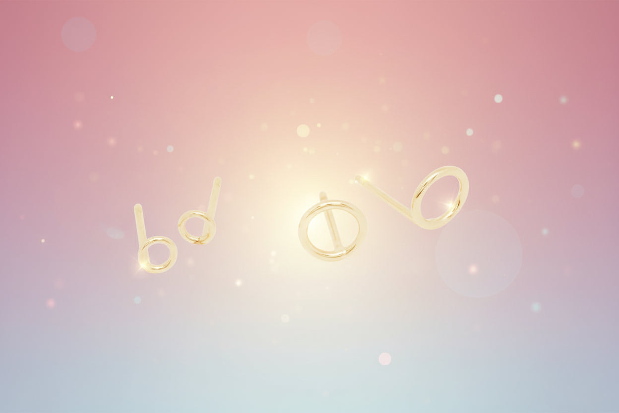 Gold earrings on a white background