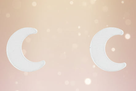 Two crescent moon symbols on a white background