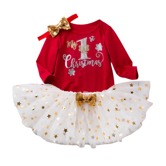Red Christmas-themed outfit with white tutu, gold bow, and 'My 1st Christmas' text on a wooden background.
