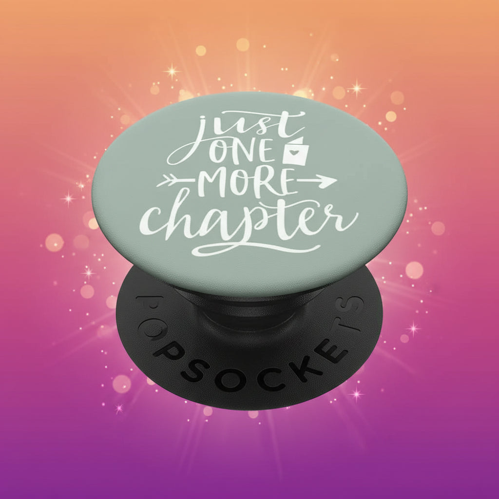PopSockets grip with 'Just One More Chapter' text on a light green background