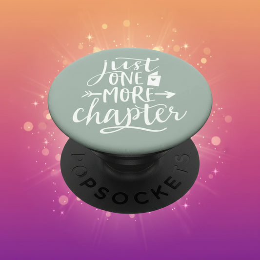 PopSockets grip with 'Just One More Chapter' text on a light green background
