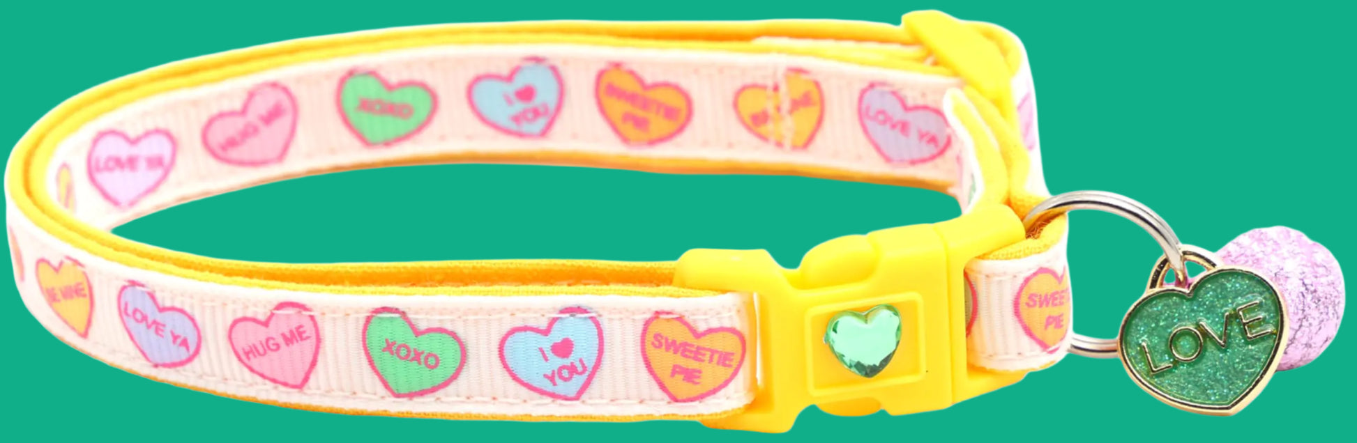 Cat collar with colorful heart patterns and a 'love' tag on a yellow background