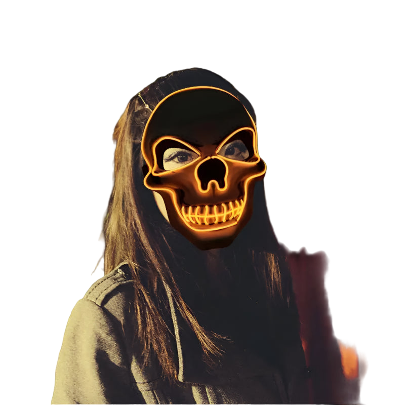 Person wearing a glowing skull mask in a crowd at night
