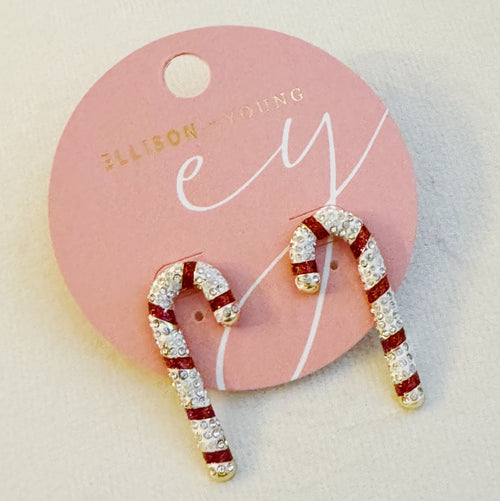 Candy cane-shaped earrings on a pink card with ' Ellison Young' branding.