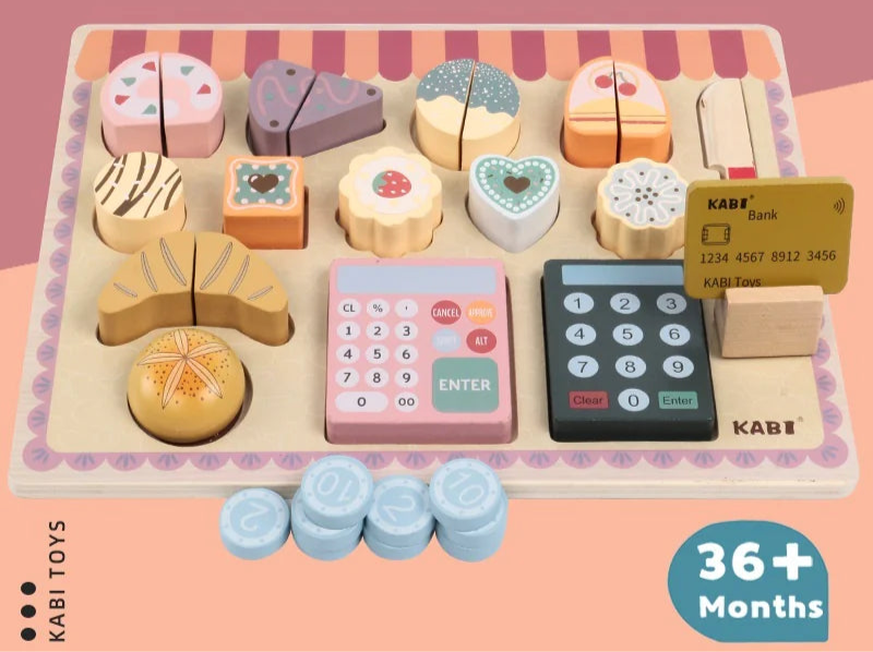 Wooden toy set for children with cookies, calculators, and money on a pink background