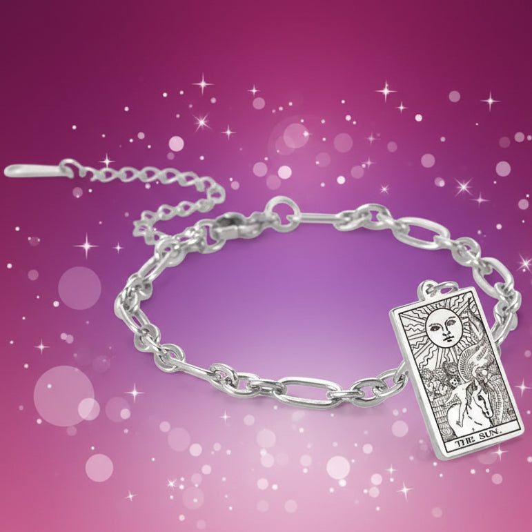 Silver bracelet with Tarot card charm on a white background