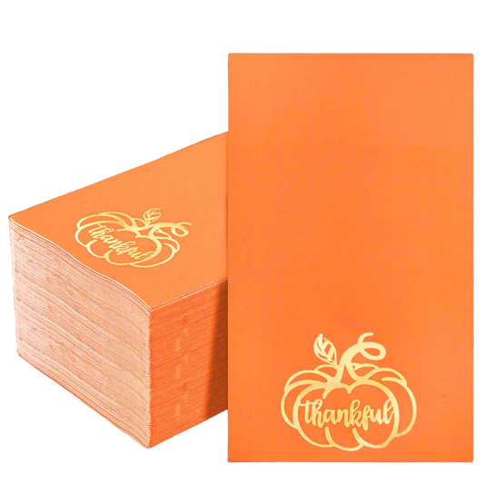 Stack of orange napkins with 'Thankful' design on a white background