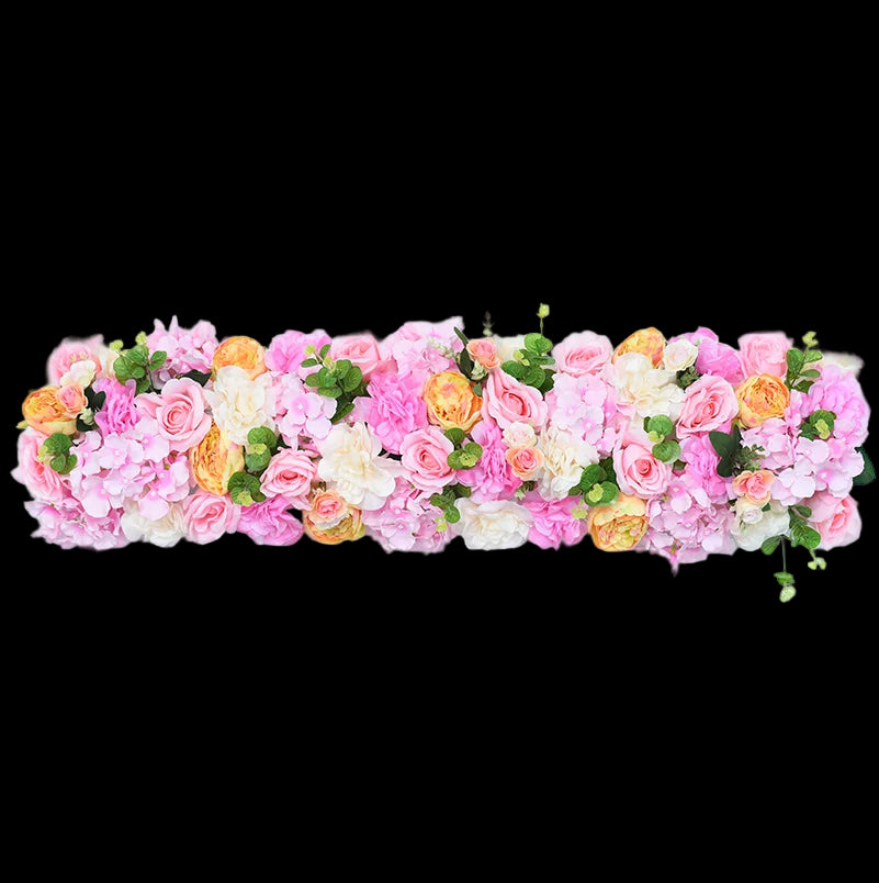 Floral arrangement with pink, orange, and white flowers on a light gray background