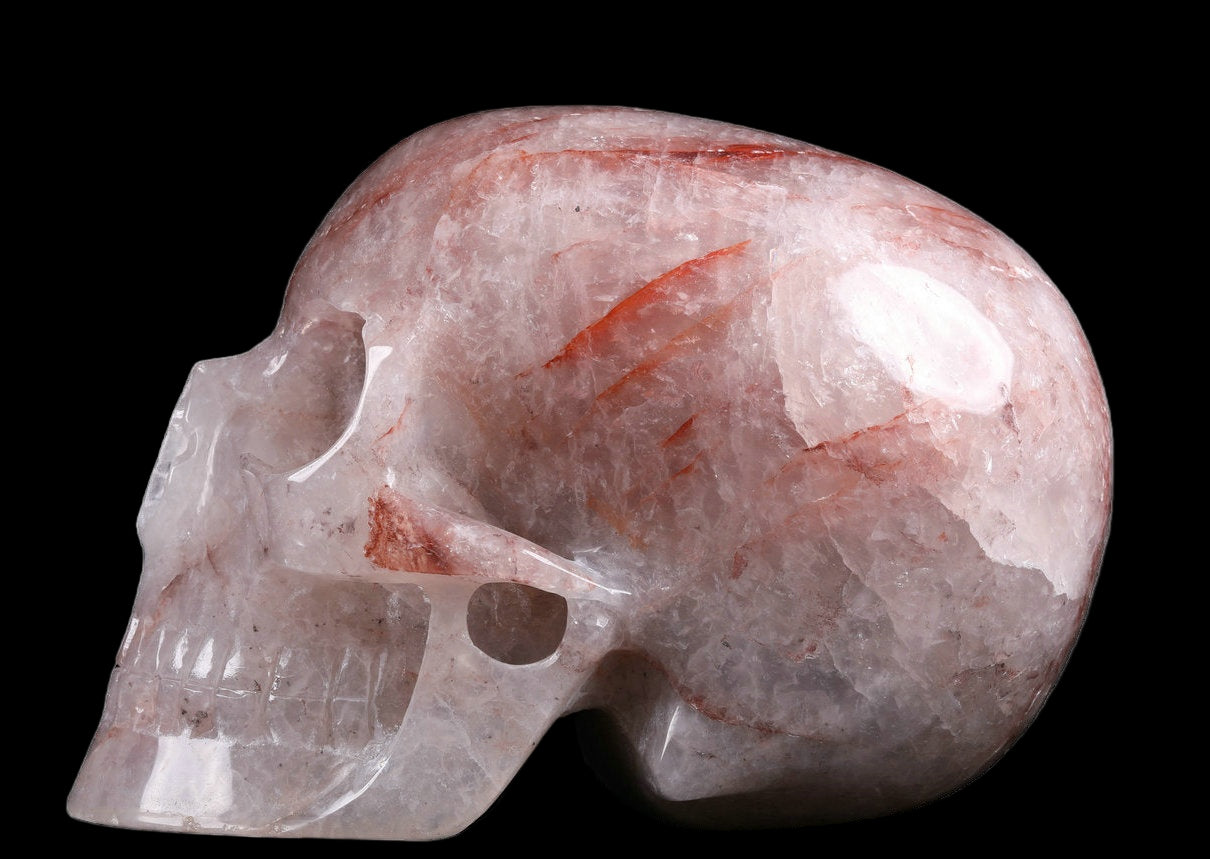 Crystal skull with pink and white patterns on a white background