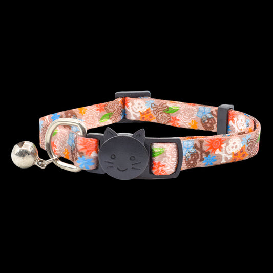 Cat collar with floral pattern and bell on a white background