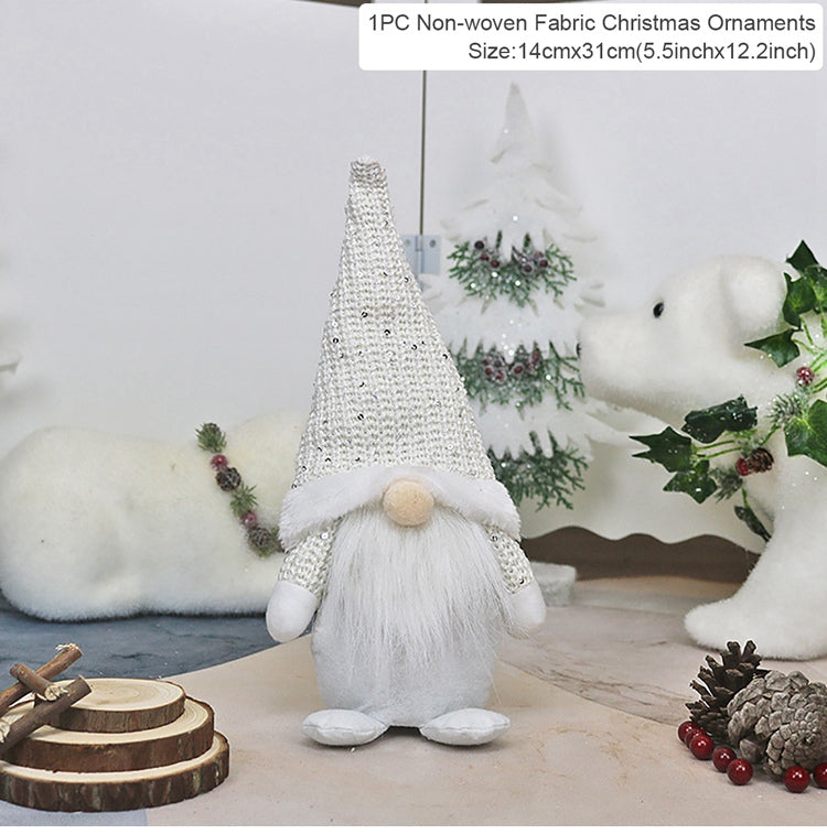 White fabric Christmas gnome ornament with a beaded hat on a decorative background.